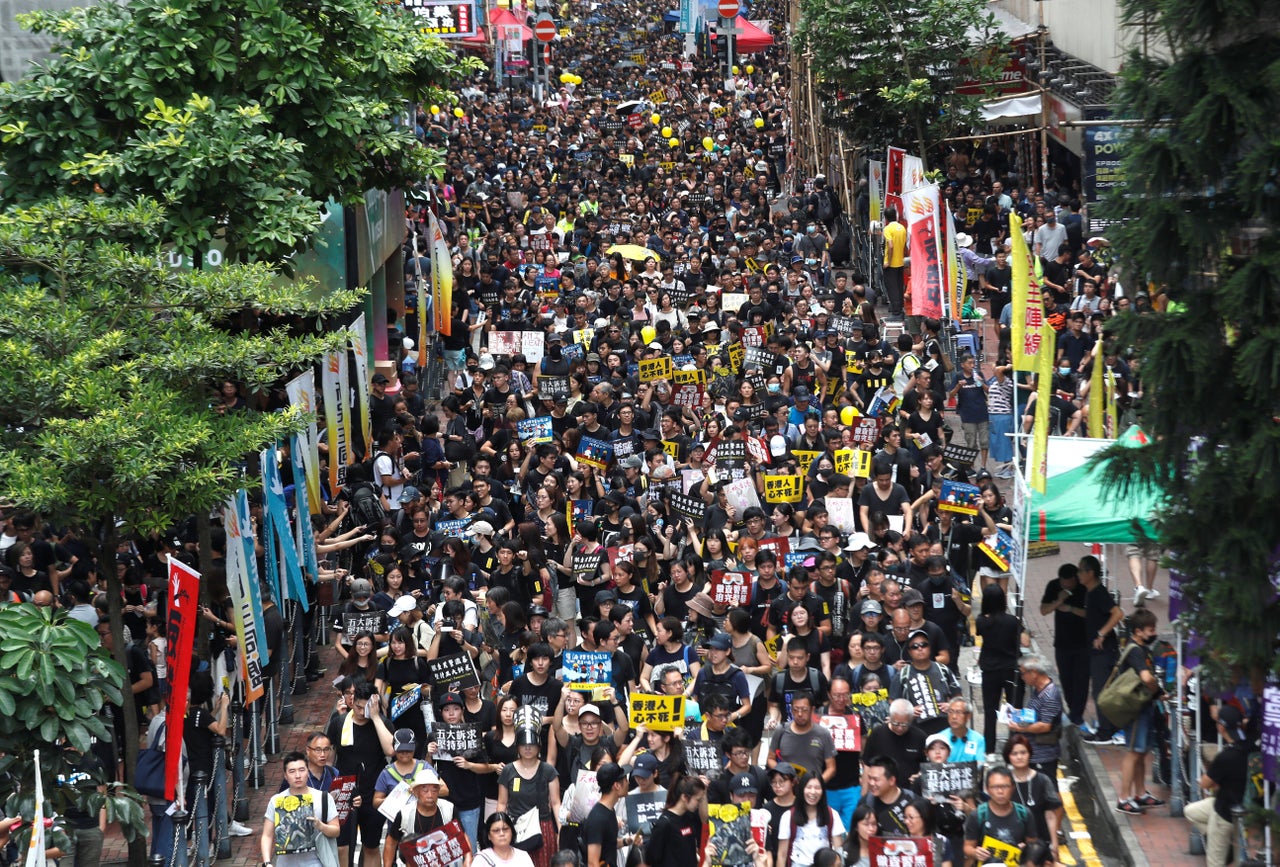 Anti-extradition bill protesters march to demand democracy and political reforms, in Hong Kong, August 18, 2019. 