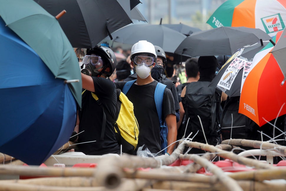 A demonstrator stands at a barricade made of bamboo poles during a protest in Hong Kong, Saturday, Aug. 24, 2019.&nbsp;