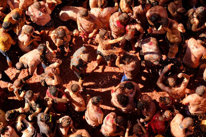 Revellers throw tomatoes during the annual "La Tomatina" food fight festival in Bunol, near Valencia, Spain, August 28, 2019. REUTERS/Heino Kalis