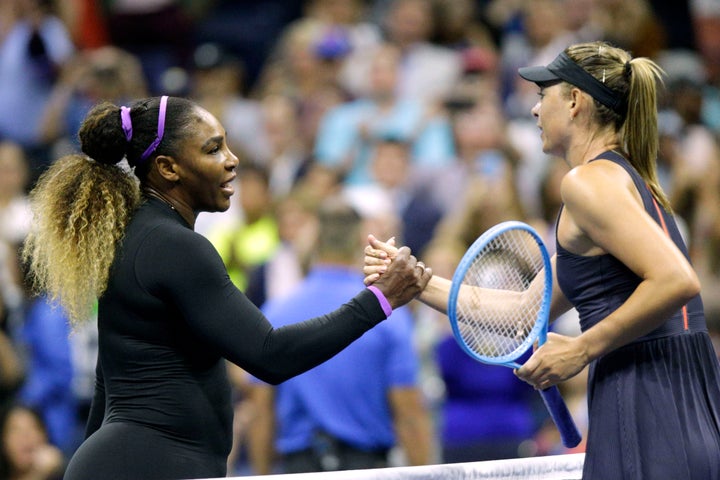 TOPSHOT - Maria Sharapova (R) of Russia shake hands after losing against Serena Williams of the United Sates during their Round 1 women's Singles match at the 2019 US Open at the USTA Billie Jean King National Tennis Center in New York on August 26, 2019. (Photo by Kena Betancur / AFP) (Photo credit should read KENA BETANCUR/AFP/Getty Images)