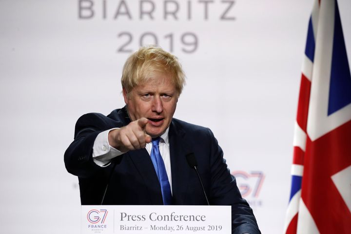 Britain's Prime Minister Boris Johnson gestures during his final press conference at the G7 summit Monday, Aug. 26, 2019 in Biarritz, southwestern France. (AP Photo/Francois Mori)