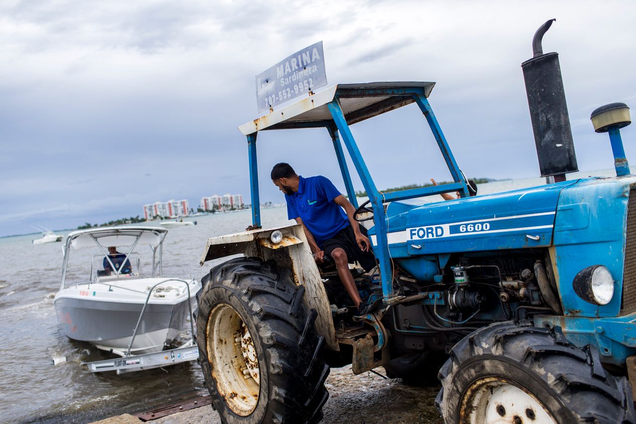 Boat owners prepare to take their vessels out of the water at Sardinera Marina in Fajardo.