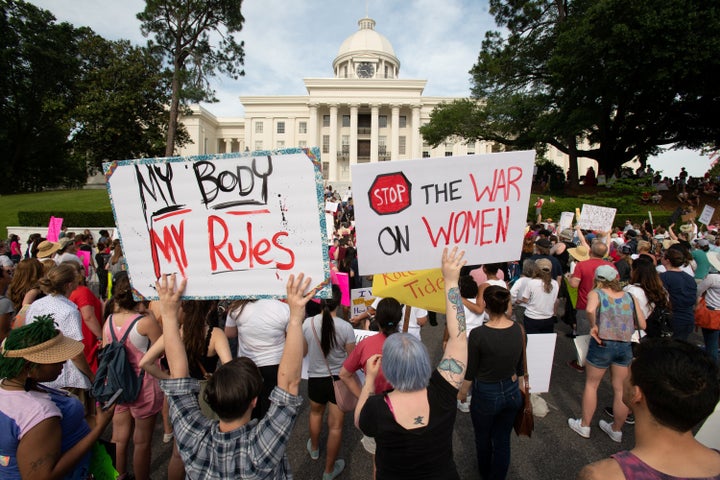 People gather at the Alabama State Capitol during the March for Reproductive Freedom against the state's new abortion law, the Alabama Human Life Protection Act, in Montgomery on May 19, 2019.