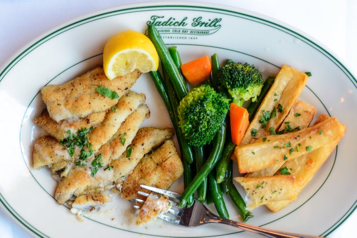 Pan-fried sand dabs with long branch potatoes, vegetables and butter sauce at Tadich Grill.