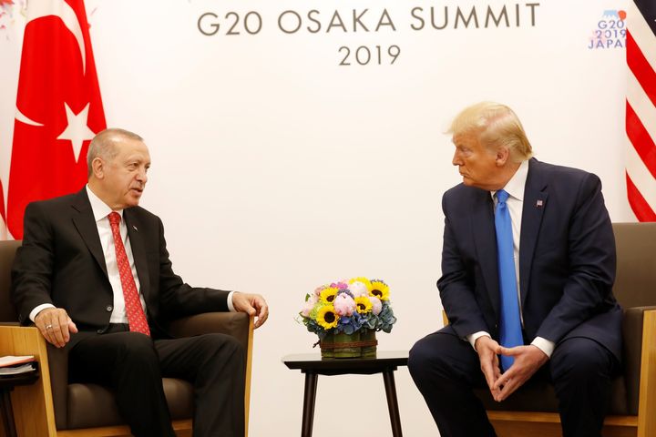 OSAKA, JAPAN - JUNE 29: (----EDITORIAL USE ONLY MANDATORY CREDIT - "TURKISH PRESIDENCY / MURAT CETINMUHURDAR / HANDOUT" - NO MARKETING NO ADVERTISING CAMPAIGNS - DISTRIBUTED AS A SERVICE TO CLIENTS----) Turkish President Recep Tayyip Erdogan (L) holds a meeting with U.S President Donald Trump (R) on the second day of the G20 Summit at INTEX Osaka Exhibition Center in Osaka, Japan on June 29, 2019. (Photo by Turkish Presidency / Murat Cetinmuhurdar / Handout/Anadolu Agency/Getty Images)