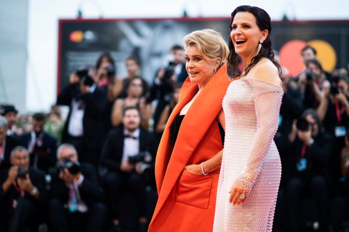 Actresses Catherine Deneuve, left, and Juliette Binoche pose for photographers upon arrival at the premiere of the film 'The Truth' and the opening gala at the 76th edition of the Venice Film Festival, Venice, Italy, Wednesday, Aug. 28, 2019. (Photo by Arthur Mola/Invision/AP)