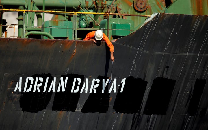 A crew member takes pictures with a mobile phone on Iranian oil tanker Adrian Darya 1, previously named Grace 1, as it sits anchored after the Supreme Court of the British territory lifted its detention order, in the Strait of Gibraltar, Spain, August 18, 2019. REUTERS/Jon Nazca TPX IMAGES OF THE DAY