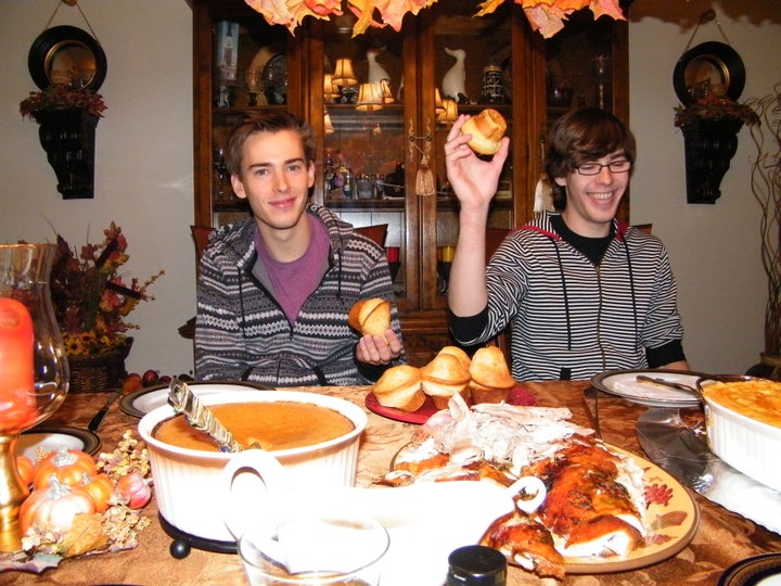 Andrew (left) and Mathew (right) sharing a laugh at Thanksgiving dinner in 2013. 