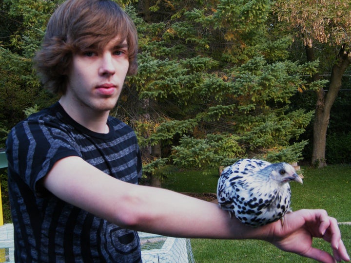 Matt holding his chicken, named Sir Guinevere, in 2009.