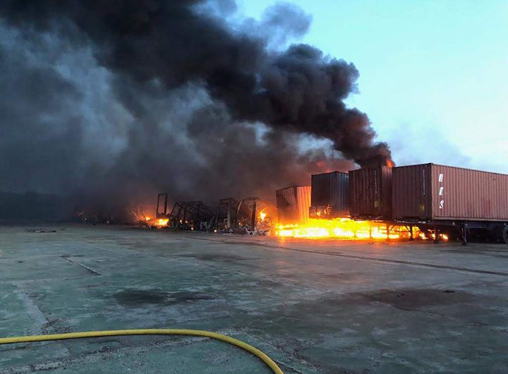 Cambridgeshire Fire and Rescue Service handout photo of containers on fire as firefighters battle a large fire at a Hotpoint factory in the Woodston area of Peterborough.