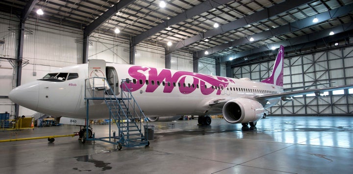 A Boeing 737-800 jetliner belonging to Swoop inside a hangar for maintenance in Edmonton, Alta., Thurs. Aug. 29, 2018.