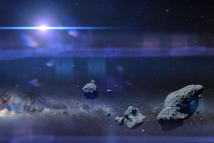 a group of huge asteroids flying through space