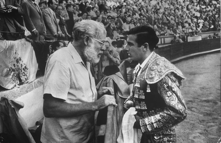 Spanish matador Antonio Ordonez (R) chatting w. his friend, author Ernest Hemingway, in arena before bullfight. (Photo by Loomis Dean/The LIFE Picture Collection via Getty Images)