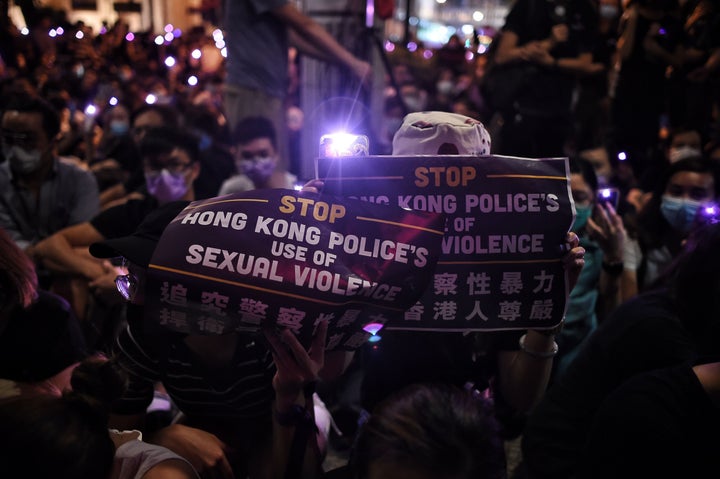 People take part in a #MeToo rally in Hong Kong on August 28, 2019, to protest alleged sexual assaults by police against anti