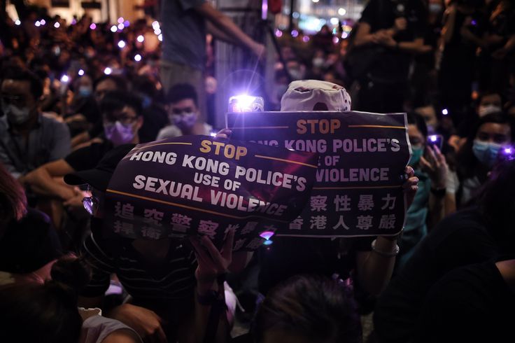 People take part in a #MeToo rally in Hong Kong on August 28, 2019, to protest alleged sexual assaults by police against anti-government female protesters. (Photo by Lillian SUWANRUMPHA / AFP) (Photo credit should read LILLIAN SUWANRUMPHA/AFP/Getty Images)