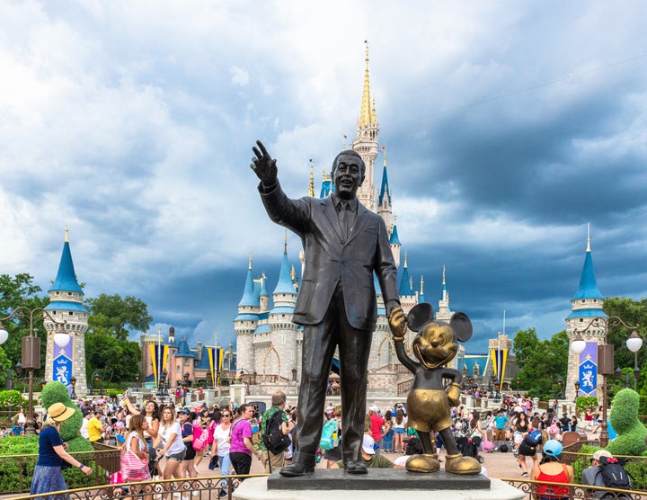 Walt Disney and Mickey Mouse statue inside of the Magic Kingdom at Disney World.