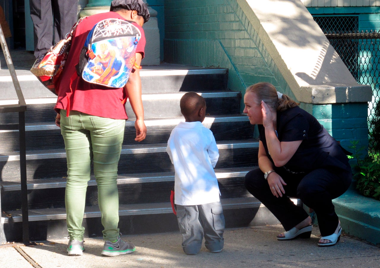 Newark School Superintendent Cami Anderson welcomes a student on the first day of classes in 2014, amid controversy over the direction of the district.