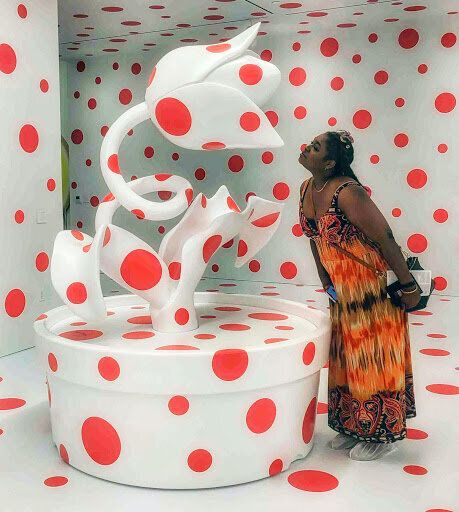 Butler at the Marciano Art Foundation in Los Angeles interacting with the Yayoi Kusama exhibit.