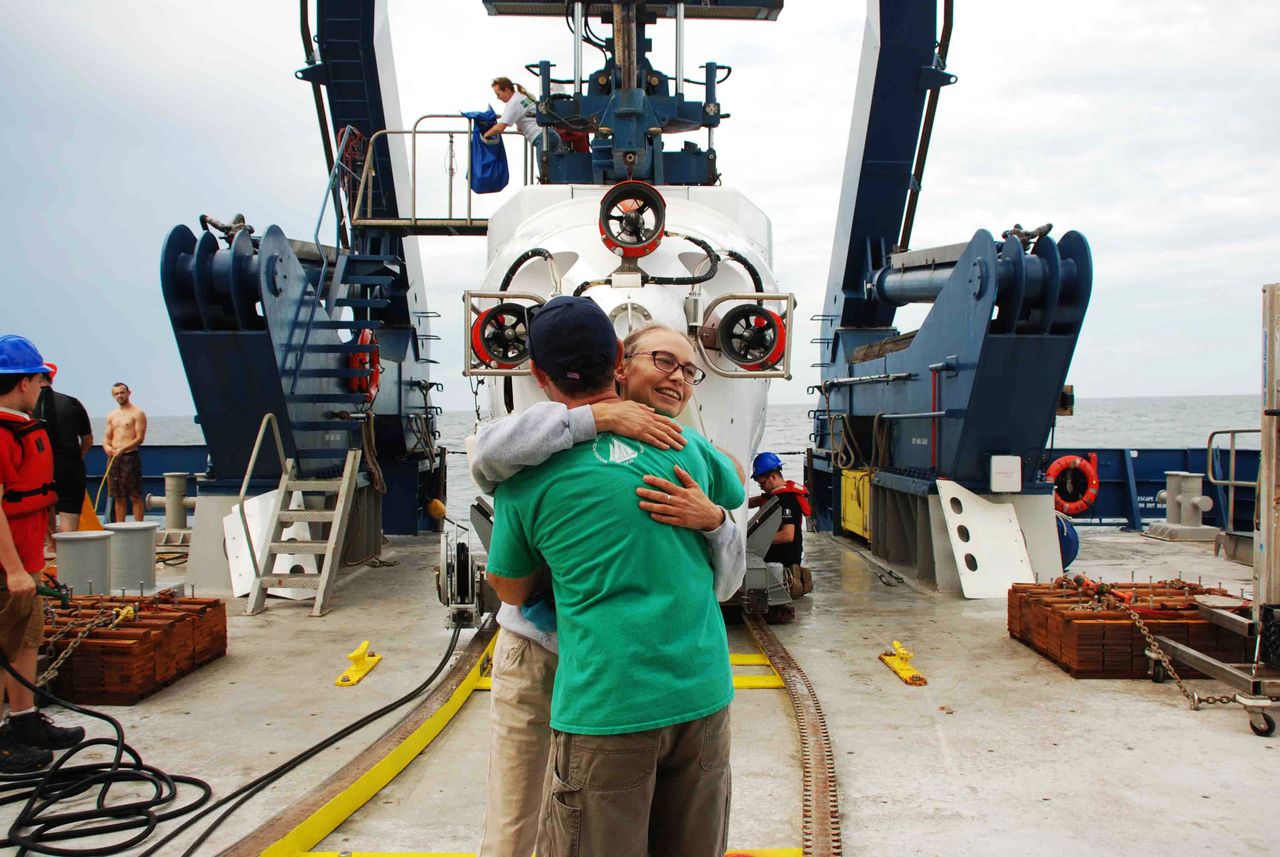 Samantha Joye and Erik Cordes hug after an Alvin dive to Pea Island seep.