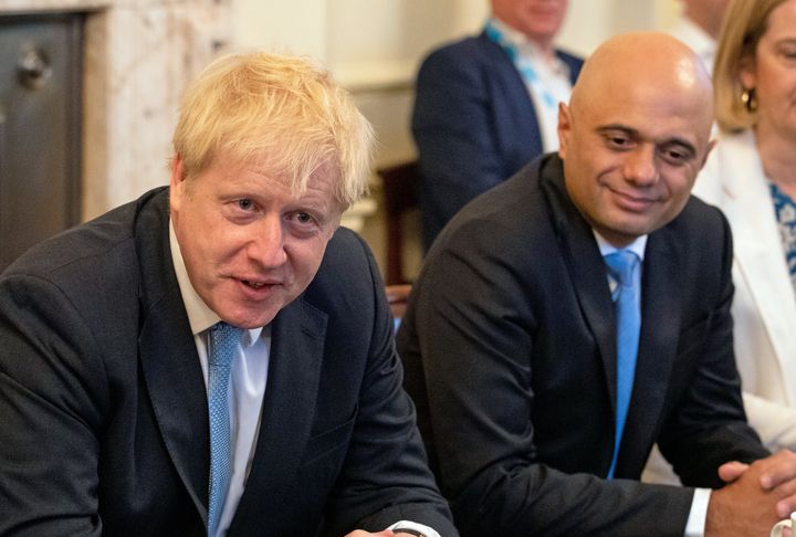 Sajid Javid (centre) and Amber Rudd with Prime Minister Boris Johnson (left) as he holds his first Cabinet meeting at Downing Street in London.