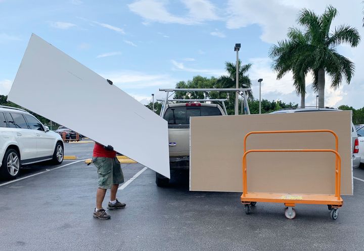 Shoppers prepare ahead of Hurricane Dorian at The Home Depot on Thursday, Aug. 29, 2019, in Pembroke Pines, Fla. (AP Photo/Brynn Anderson)
