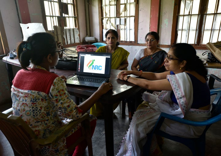 Officials checks the documents submitted by people at an National Register of Citizens (NRC) Seva Kendra in Guwahati, Assam, India on Aug 30, 2019. The NRC with the final list of citizens will be published tomorrow on August 31, 2019. (Photo by David Talukdar/NurPhoto via Getty Images)