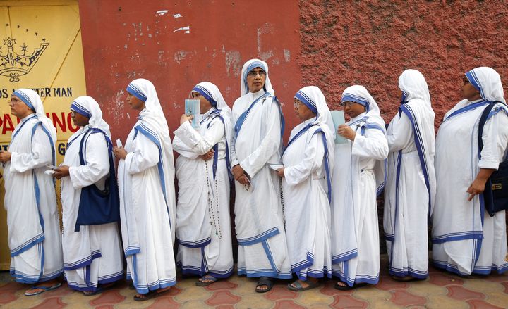 Catholic nuns from the Missionaries of Charity stand in a queue as they wait to cast their vote outside a polling station during the final phase of general election in Kolkata, India, May 19, 2019. 