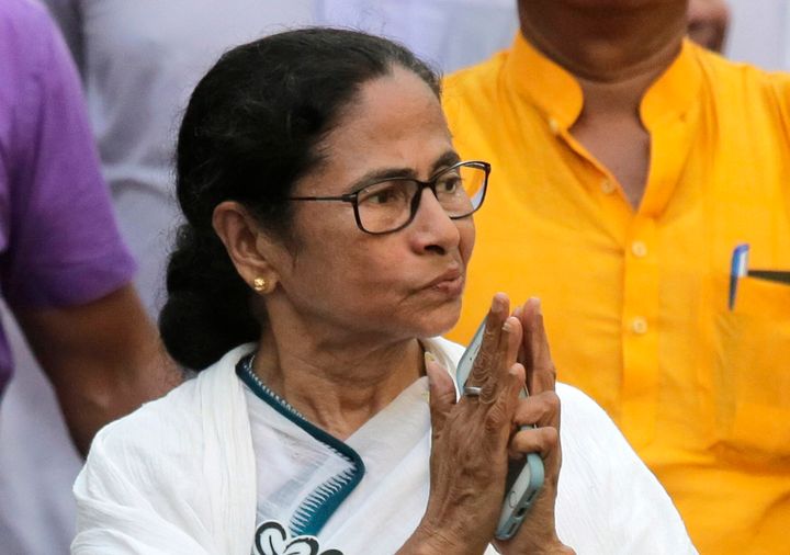 FILE- In this Friday, May 10, 2019 file photo, Trinamool Congress party leader and Chief Minister of West Bengal state Mamata Banerjee greets the crowd during an election campaign rally in Kamarhati, about 25 kilometers north of Kolkata, India. India’s Prime Minister Narendra Modi has taken his Bharatiya Janata Party’s fight to the state of West Bengal, where it hopes to retain a majority in staggered general elections concluding this week by diluting the strength of a formidable opponent, chief minister Mamata Banerjee. (AP Photo/Bikas Das, File)