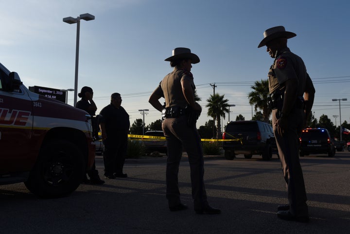 State troopers and other emergency personnel monitor the scene at a local car dealership following a shooting in Odessa, Texas, on Saturday.