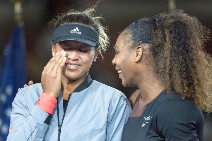 A tearful Naomi Osaka is comforted by Serena Williams after the women's singles final at the US Open on Sept. 8, 2018.