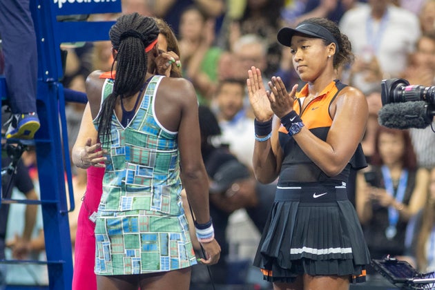 Naomi Osaka, right, claps for a teary Coco Gauff as they give an interview to ESPN after round three...
