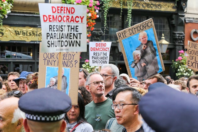 LONDON, UNITED KINGDOM - 2019/08/31: Protesters with placards during the demonstration.Anti-Brexit protest in Whitehall, Westminster against the <a href='/hashtag/British'>British</a> Prime Minister <a href='/hashtag/Boris-Johnson'>Boris Johnson</a> and the <a href='/hashtag/UK'>UK</a> Government proroguing Parliament for five weeks ahead of the Queens Speech on 14 October, just two weeks before the UK is set to leave the EU. (Photo by Steve Taylor/SOPA Images/LightRocket via Getty Images)