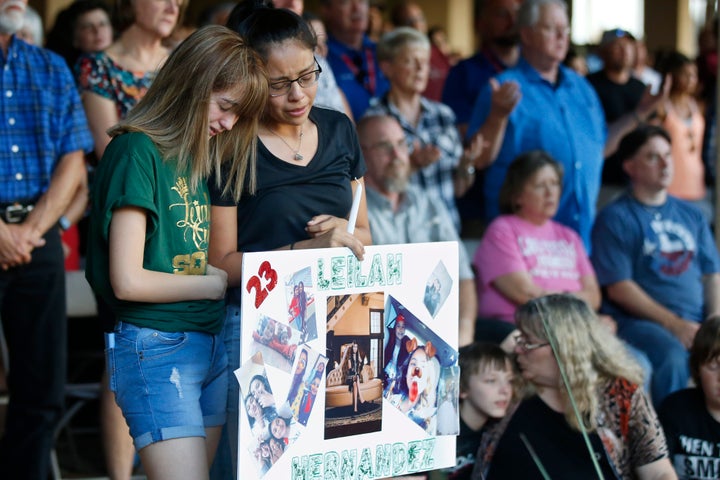 High School students Celeste Lujan, left, and Yasmin Natera, right, mourn their friend Leila Hernandez, one of the victims of the Saturday shooting in Odessa, at a memorial service on Sunday.