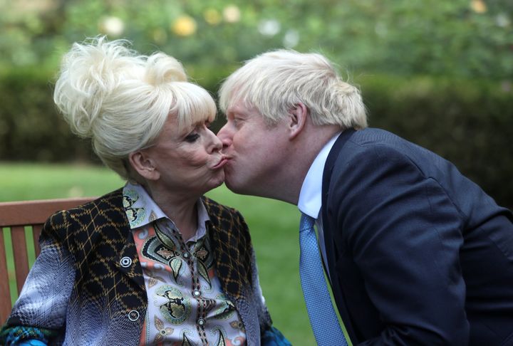 Prime minister Boris Johnson kisses Dame Barbara Windsor at the end of their meeting