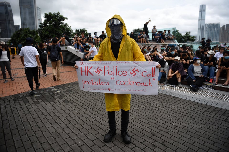 TOPSHOT - A protester holds a sign during a rally at Tamar Park in Hong Kong on September 2, 2019, in...