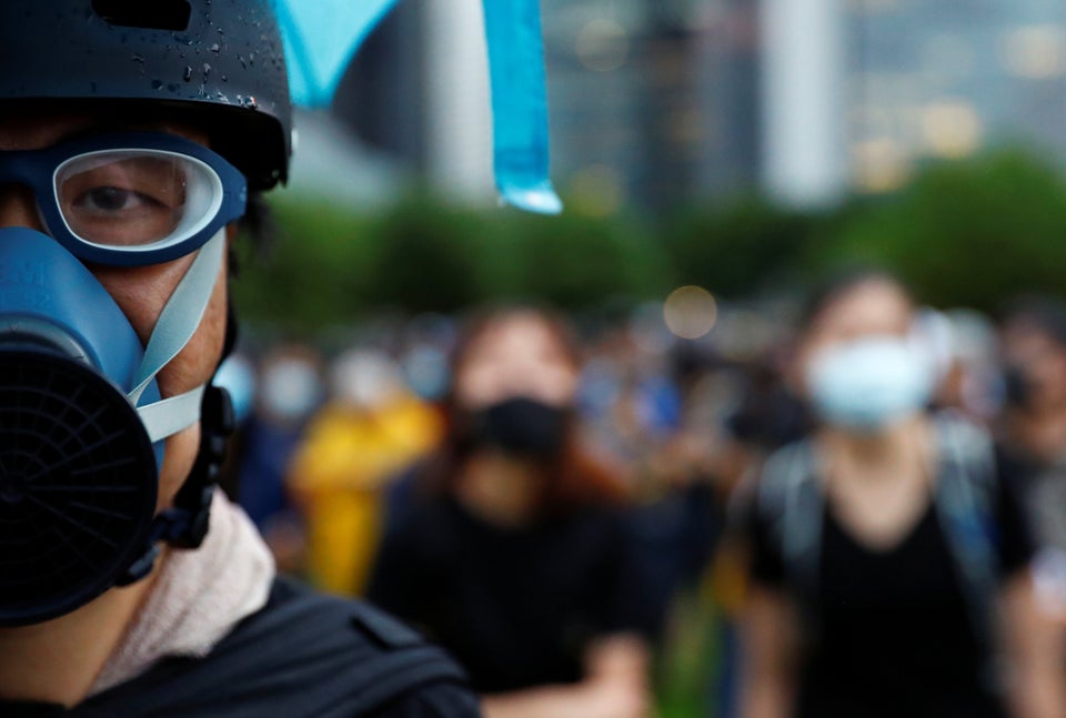 A protester is pictured during a general strike at Tamar Park in front of the government buildings in...