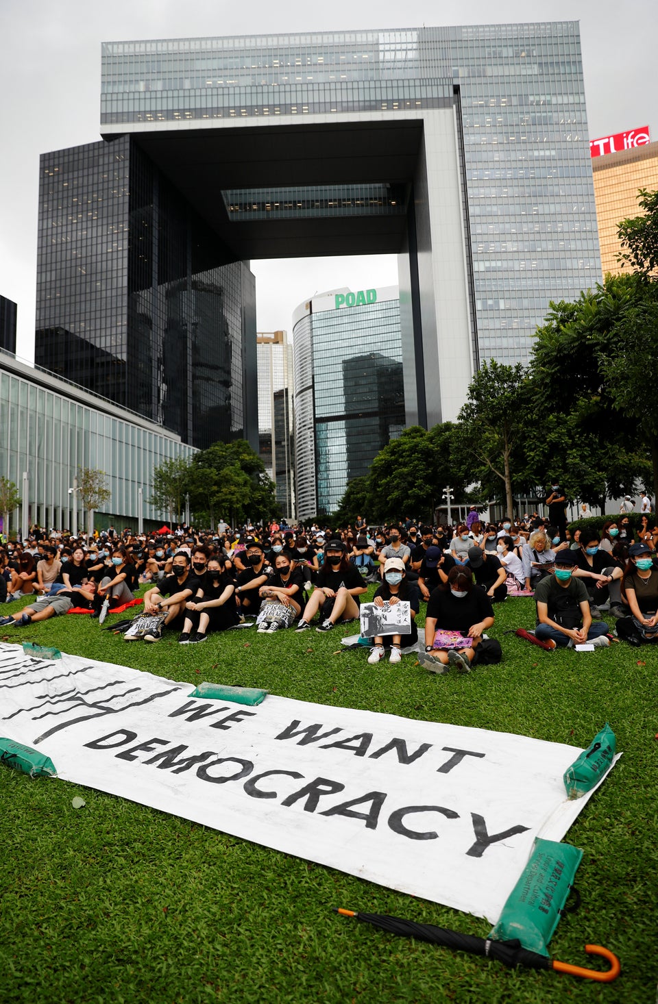 People take part in a general strike at Tamar Park in front of the government buildings in Hong Kong,...