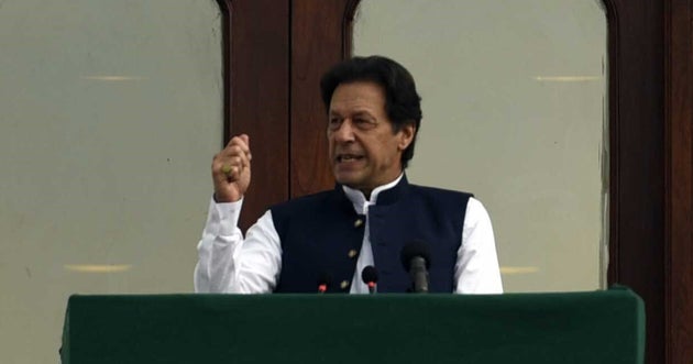 Prime Minister of Pakistan, Imran Khan addresses the crowd during a rally in front of Prime Minister...