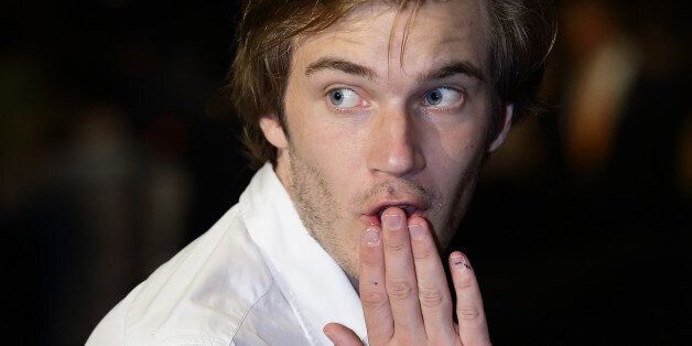 SINGAPORE - MAY 23: PewDiePie gestures on the red carpet during the Social Star Awards 2013 at Marina Bay Sands on May 23, 2013 in Singapore. (Photo by Suhaimi Abdullah/Getty Images)
