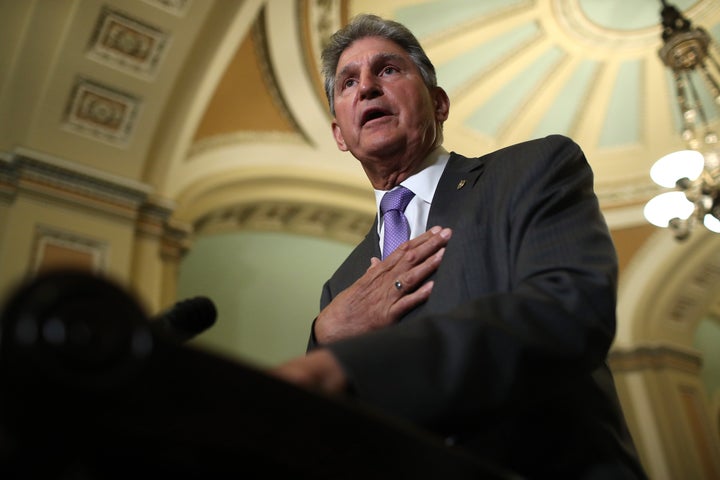 Sen. Joe Manchin (D-W.Va.) answers questions at the U.S. Capitol on July 9.