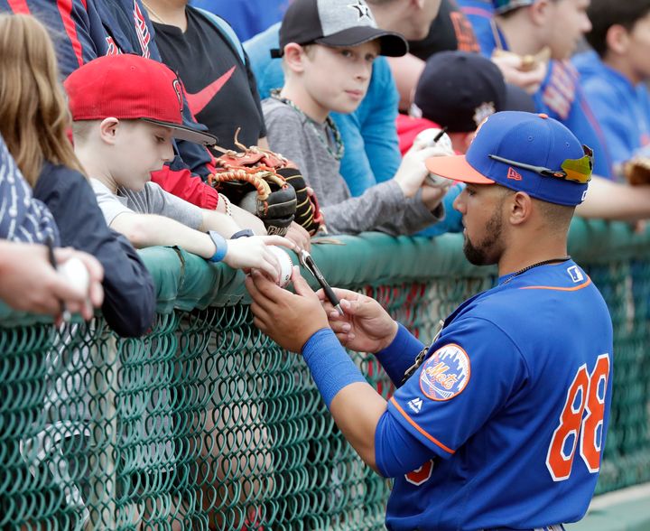 Sam Haggerty, pictured signing autographs during spring training, is a real member of the Mets following his promotion.