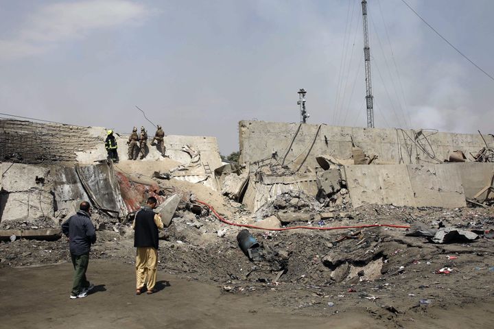 Afghan security forces investigate at the site near the crater from where a tractor packed with explosives exploded the night before at the Green Village in Kabul on September 3, 2019. - A massive blast in a residential area of Kabul killed at least 16 people, officials said September 3, following yet another Taliban attack that came as the insurgents and Washington try to finalise a withdrawal deal. (Photo by STR / AFP) (Photo credit should read STR/AFP/Getty Images)