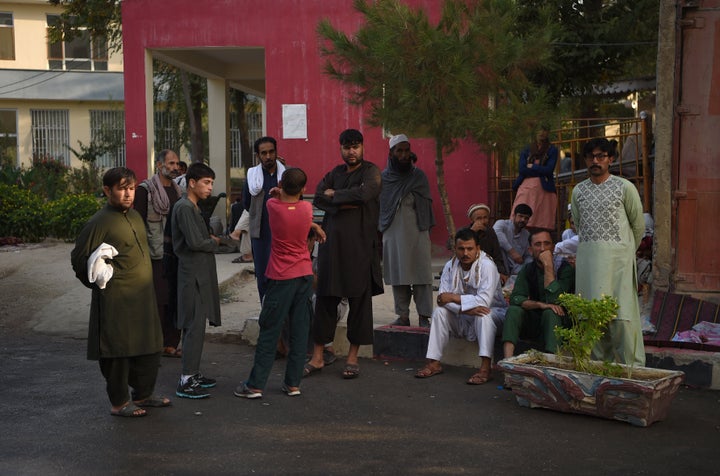 Relatives of Afghan victims wait outside the Wazir Akbar Khan hospital after a massive explosion the night before in Kabul on September 3, 2019. - A massive explosion rocked central Kabul late on September 2, killing at least five people in a Taliban-claimed attack near an international complex while the US special envoy leading talks with the insurgents visited the Afghan capital. (Photo by WAKIL KOHSAR / AFP) (Photo credit should read WAKIL KOHSAR/AFP/Getty Images)