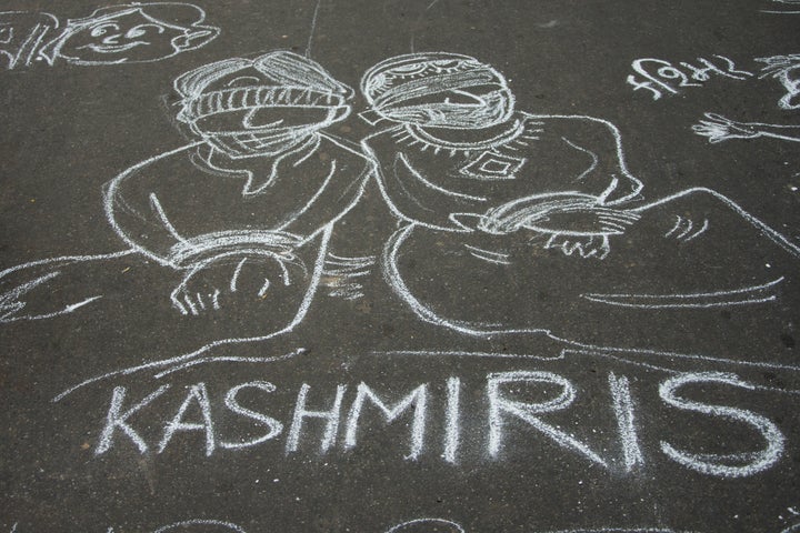 People attend a protest in solidarity with Kashmir over the removal of Article 370 and the forced shut down of all communication means in the valley in Delhi, India on August 07, 2019.