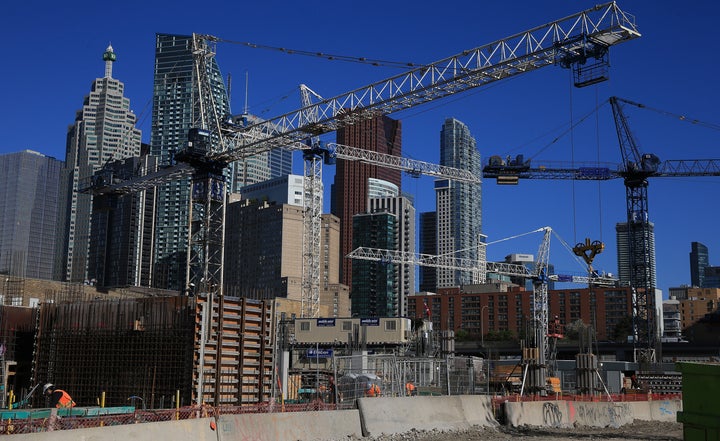 Construction cranes fill the sky at a site at Queen's Quay in Toronto, June 12.