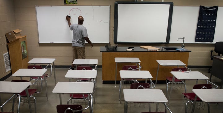 Gardendale High School biology teacher Justin Ingram readies his classroom before school begins in Gardendale, Alabama, on Aug. 4, 2016. Gardendale is a small city whose schools tried to secede from their larger district.