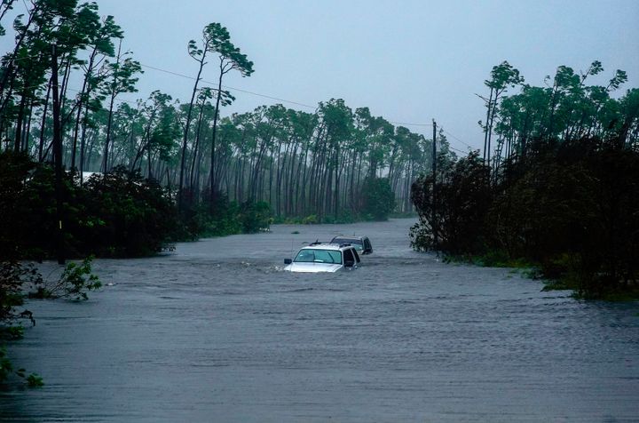 Submerged car sit submerged in water from Hurricane Dorian in Freeport, Bahamas, Tuesday, Sept. 3, 2019. Dorian is beginning to inch northwestward after being stationary over the Bahamas, where its relentless winds have caused catastrophic damage and flooding.(AP Photo/Ramon Espinosa)