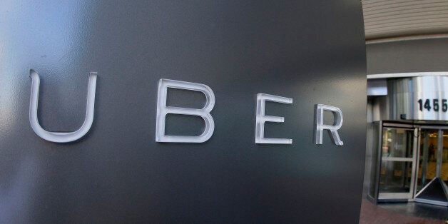 FILE - In this Dec. 16, 2015, file photo, a man leaves the headquarters of Uber in San Francisco. The...