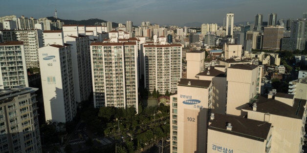 Samsung apartment buildings are shown before the city skyline of Seoul on August 25, 2017.Heir to the...