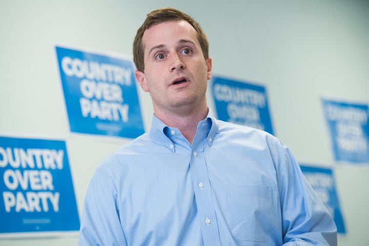 Dan McCready, Democratic candidate for North Carolina's 9th District, talks with voters at his campaign office during his edu